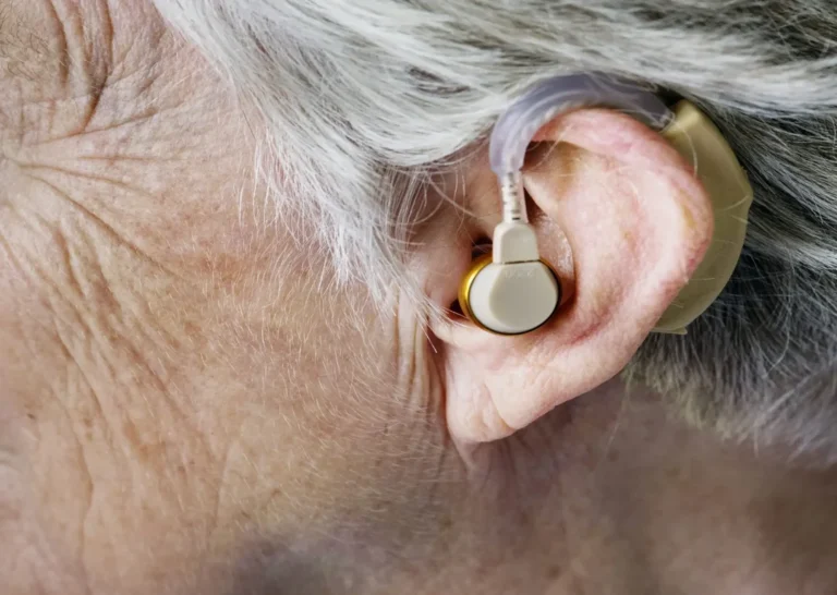 Home 10 senior using hearing aid